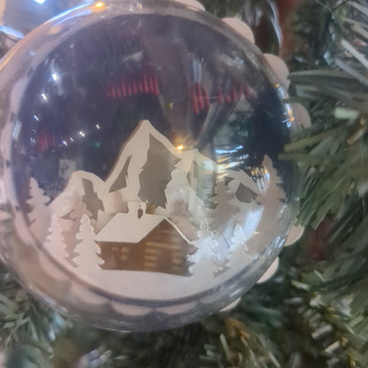 Layered 3D ornaments cabin and northern lights