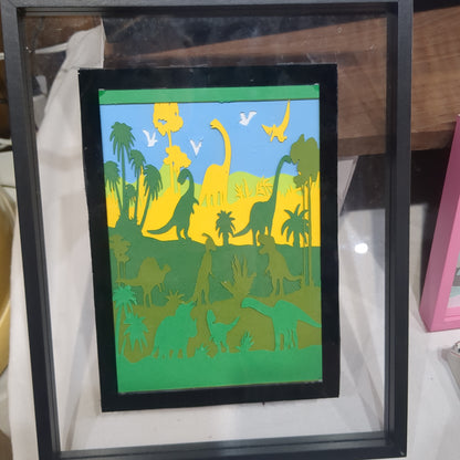 8 x 10” frame with 5 x 7" paper cut dinosaur scene