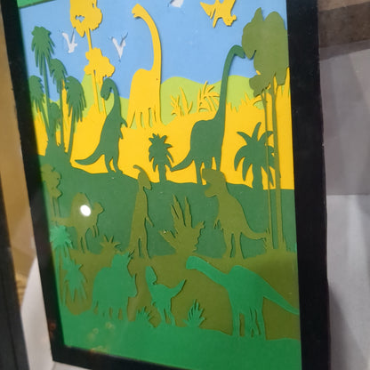 8 x 10” frame with 5 x 7" paper cut dinosaur scene