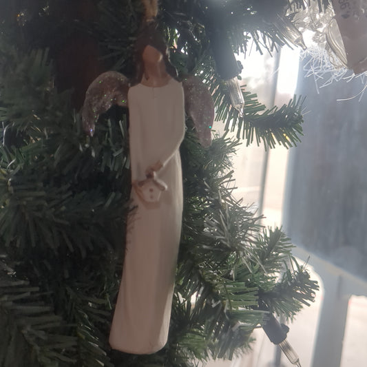 Angel holding a birdhouse ornament