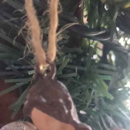 Angel holding a birdhouse ornament