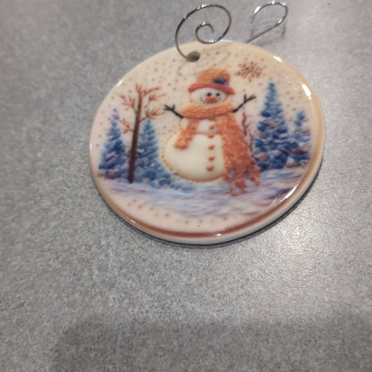 Ceramic ornament snowman with orange hat and and orange scarf