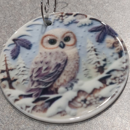 Ceramic ornament with an owl sitting on a branch, it appears 3D but it is not