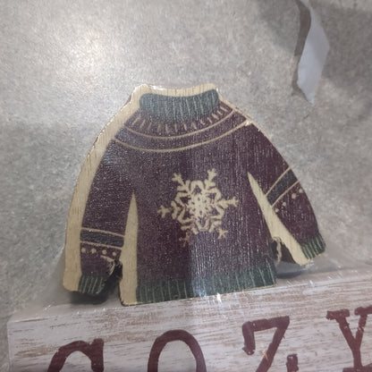 Cozy Christmas sign with a sweater