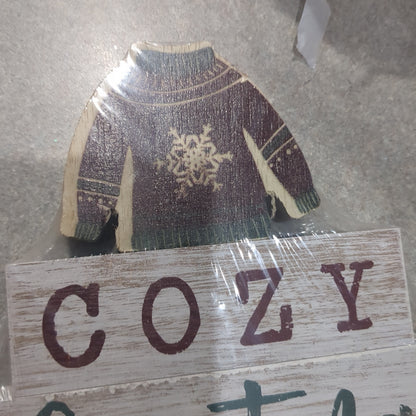 Cozy Christmas sign with a sweater