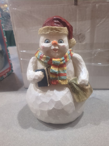 World Bazaars Polycrylic snowman.  Holding book and bag