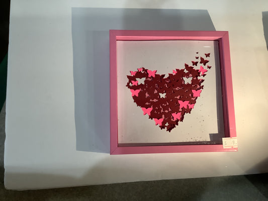 5 1/2” x 5 1/2” pink shadow box with paper cut butterfly heart fly away