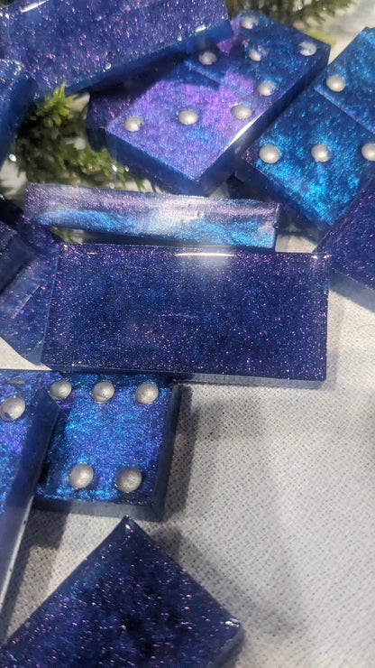 This is a set of handcrafted resin dominoes color changing blue and purple