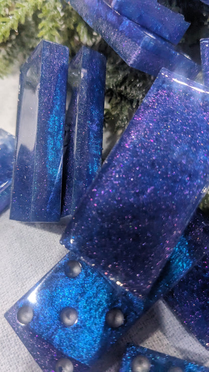 This is a set of handcrafted resin dominoes color changing blue and purple