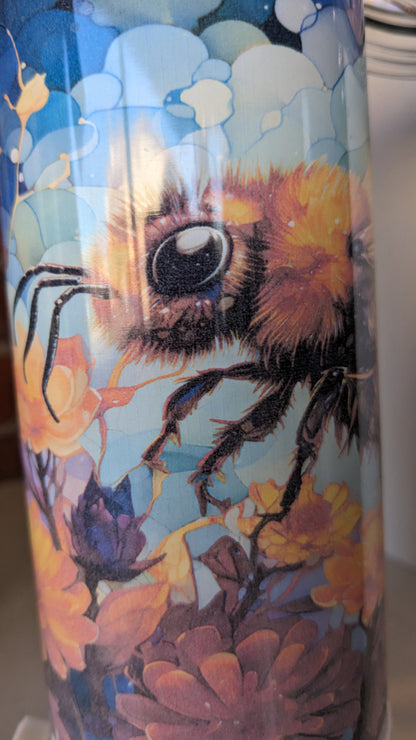 REDUCED PRICE 17 Oz Speaker Tumbler Colorful Bee. Has some fading of flowers beneath the bee