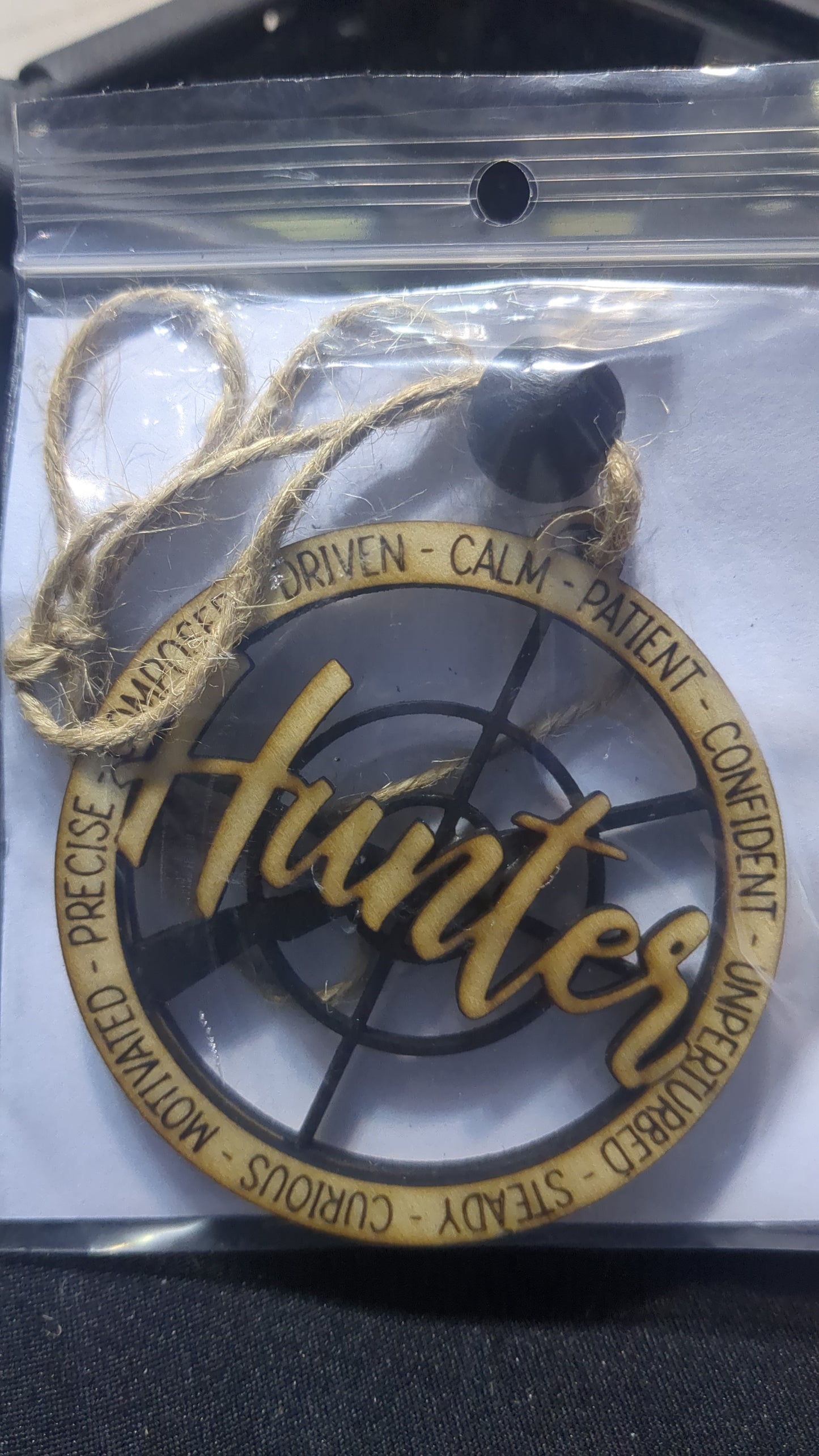 Wooden ornament or car charm.  Hunter