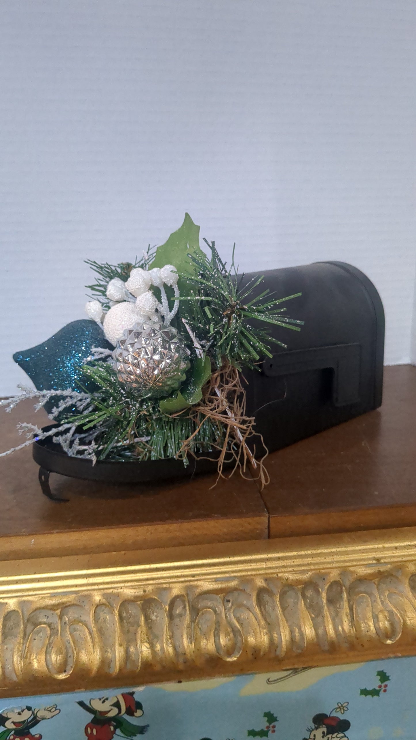 Christmas sculpture in tin mailbox