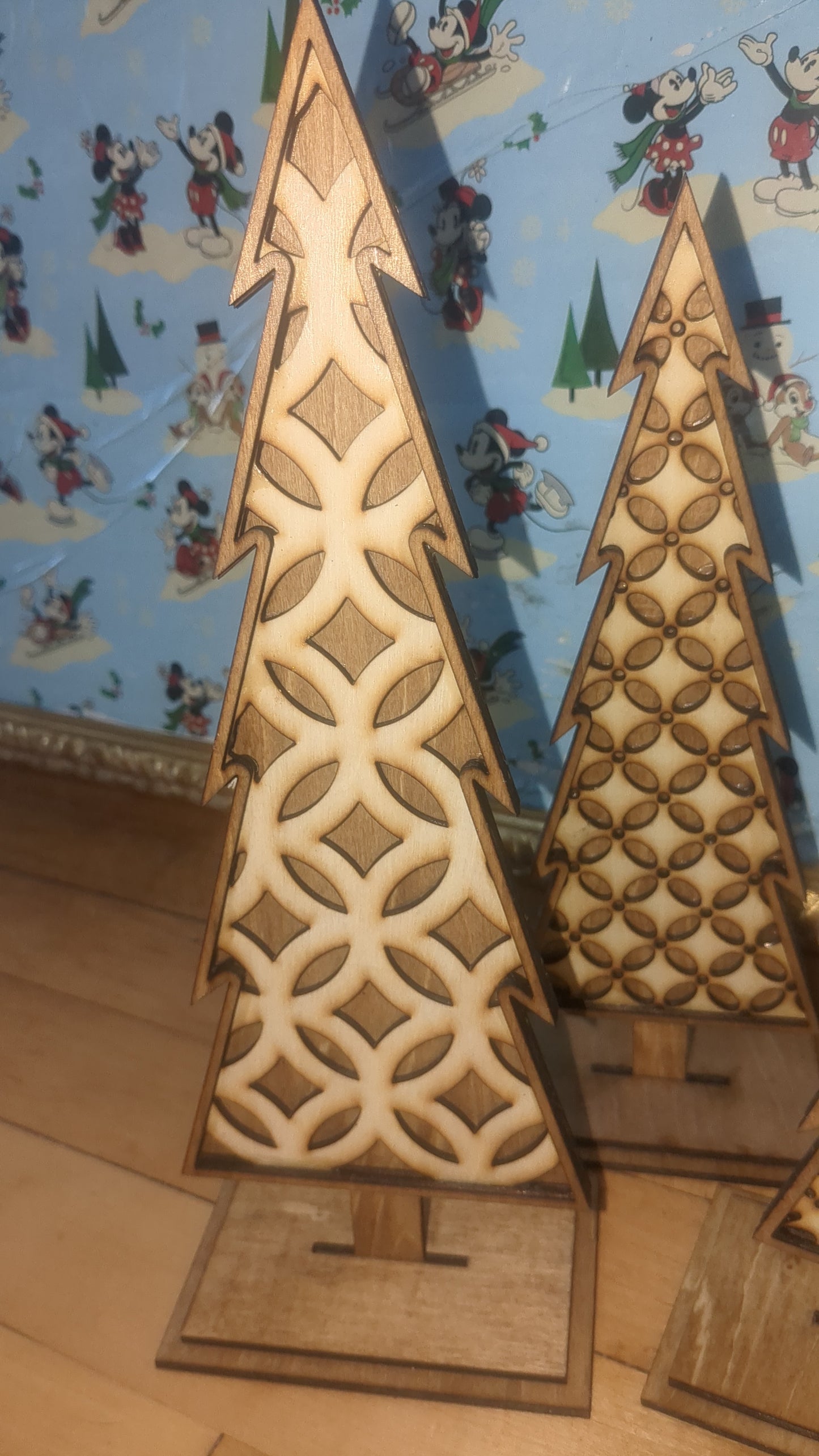 Standing wooden patterned layered trees.  Unique decor pieces sold as a set.