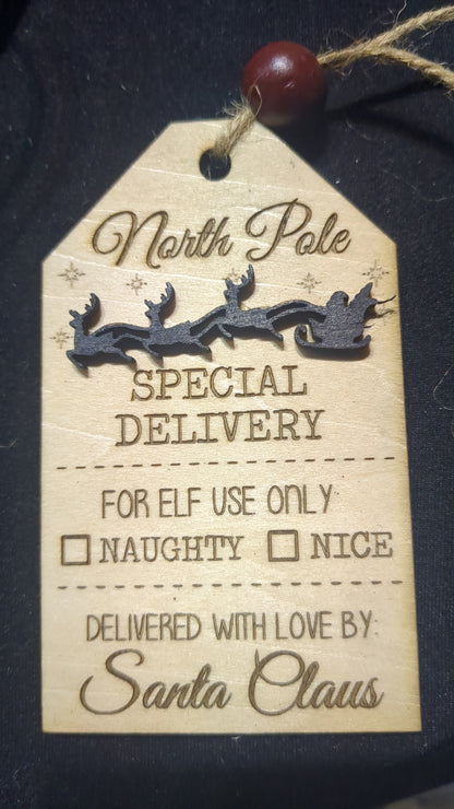 Wooden ornament or car charm.  North Pole special delivery.  Elf use.