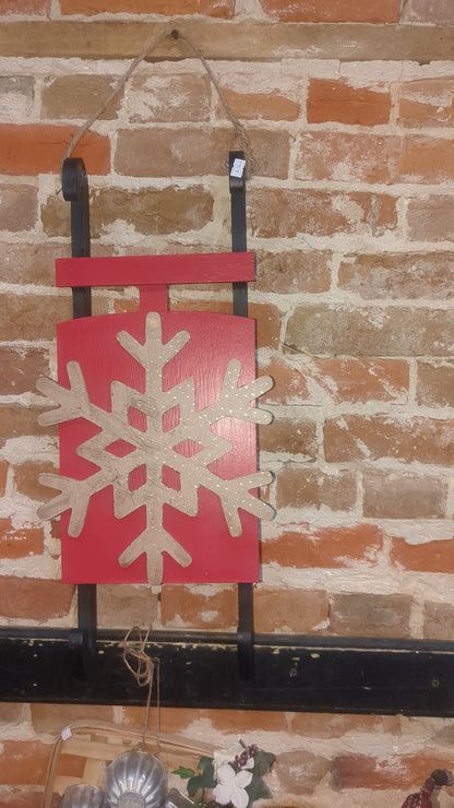 Red wooden sled with MDF snowflaked