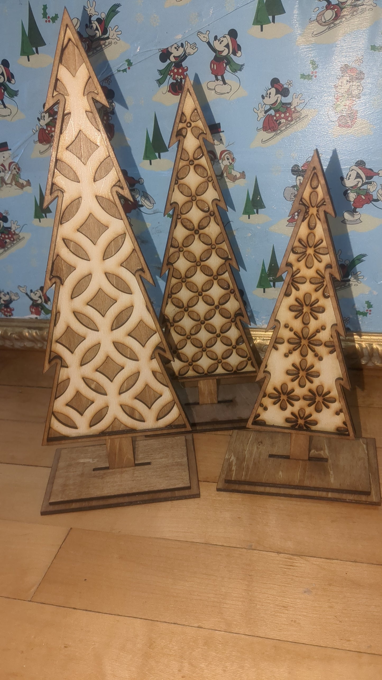 Standing wooden patterned layered trees.  Unique decor pieces sold as a set.