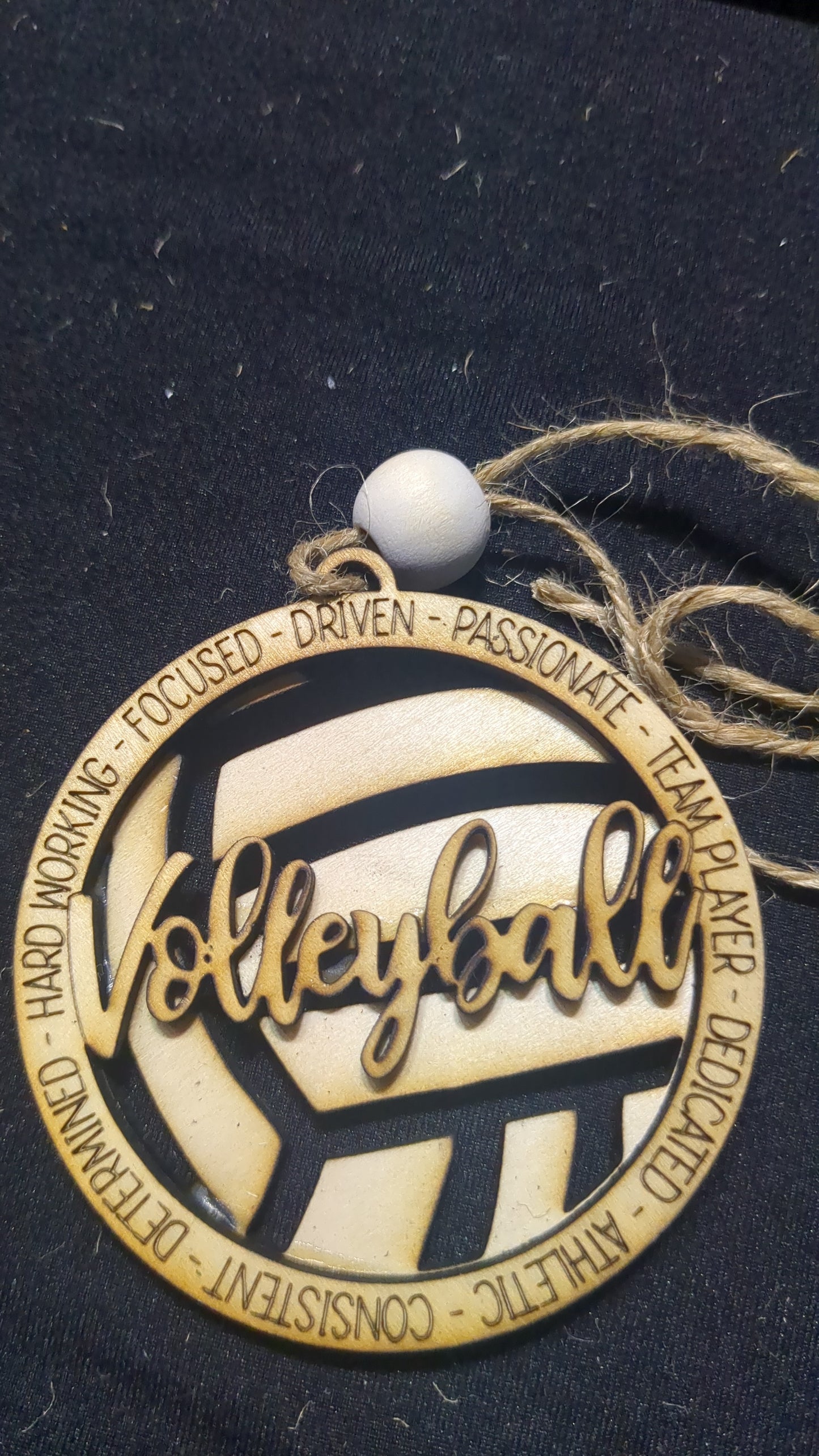 Wooden ornament or car charm.  Volleyball