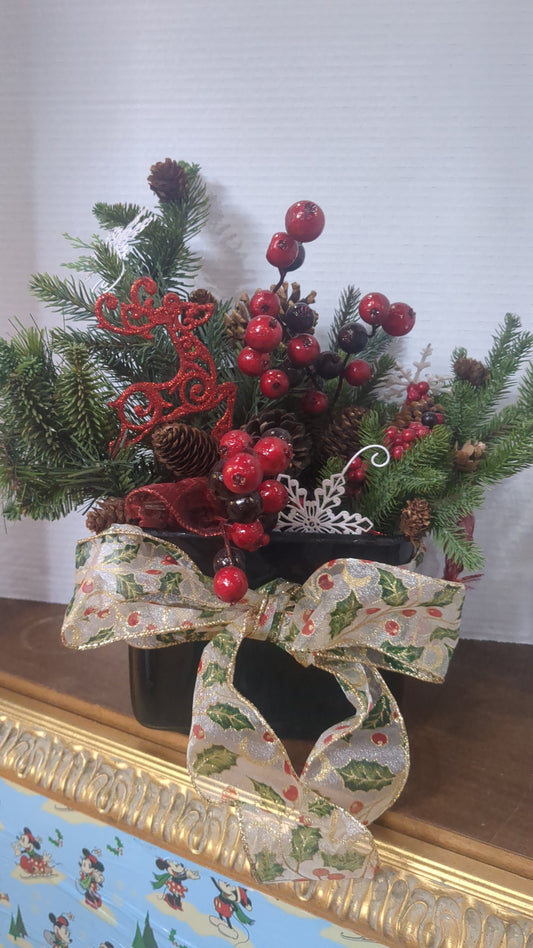 Evergreen Christmas arrangement in tin box