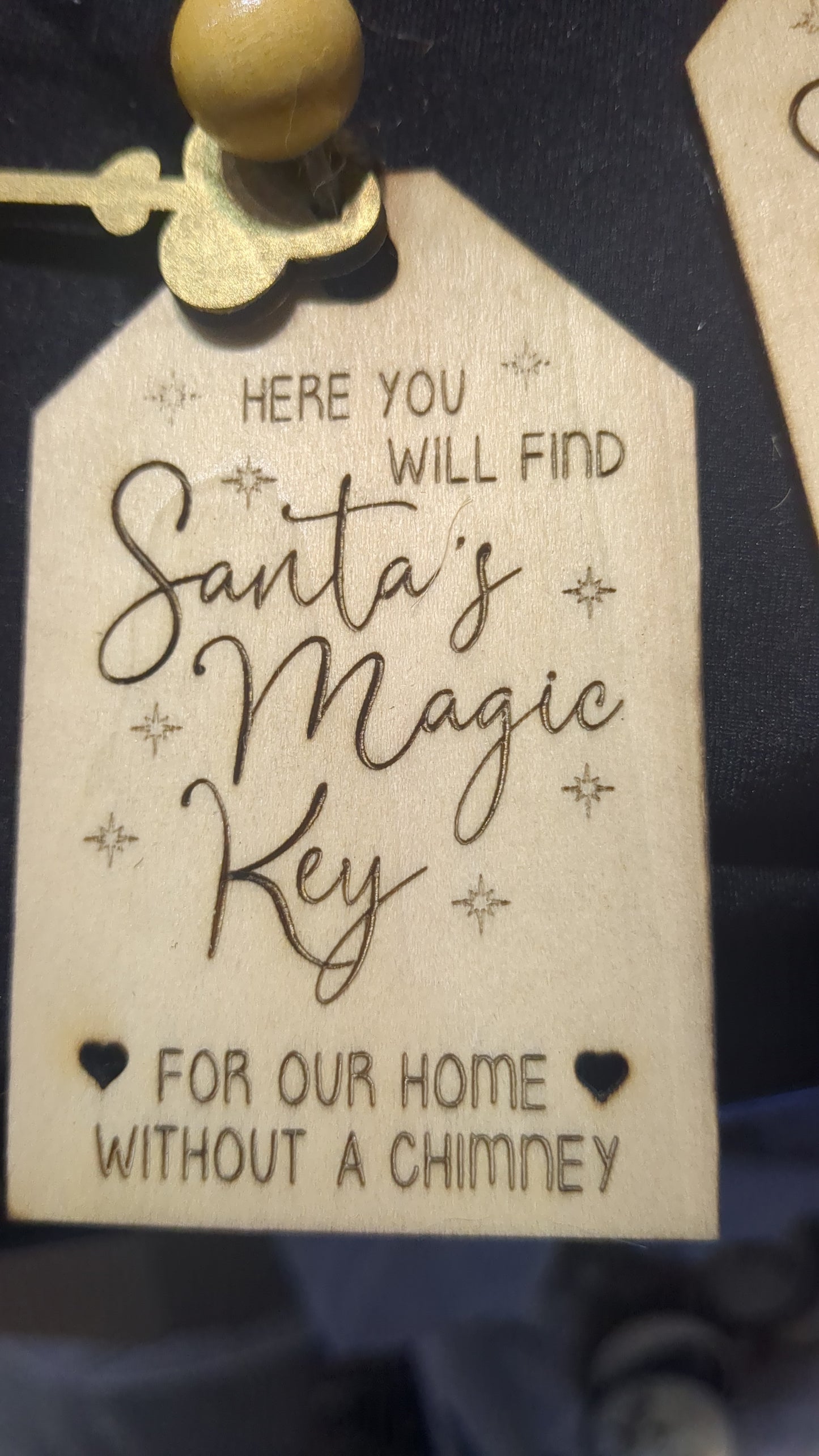 Wooden ornament or car charm.  Santa's magic key for our home without a chimney.  Gold colored wooden key.