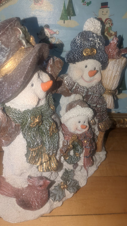 Snowman of three family with Cardinals