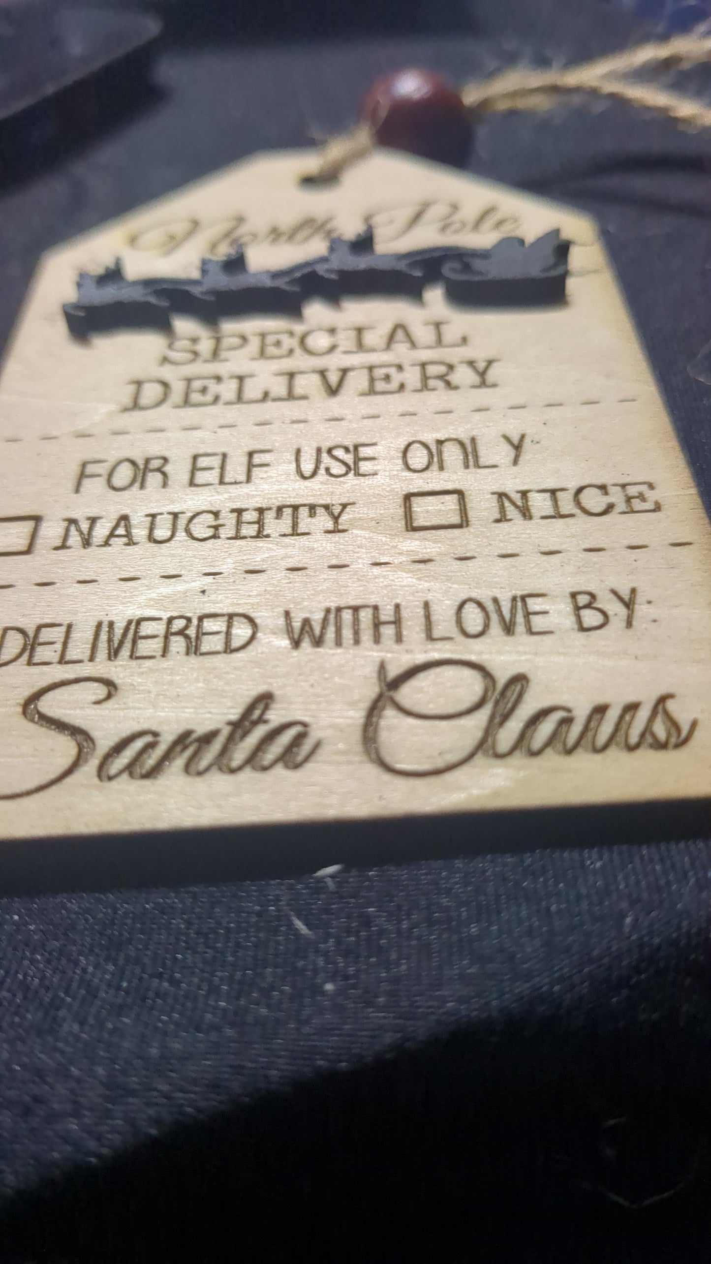 Wooden ornament or car charm.  North Pole special delivery.  Elf use.