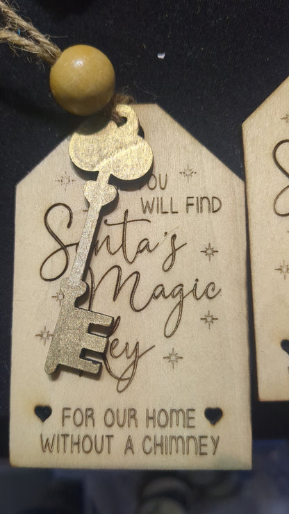 Wooden ornament or car charm.  Santa's magic key for our home without a chimney.  Gold colored wooden key.